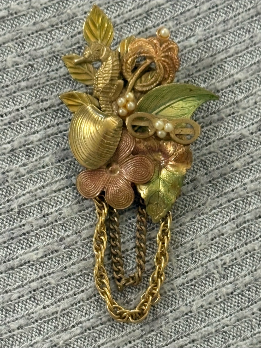 Vintage gold tone bouquet style floral brooch w seahorse, seashell, leaves